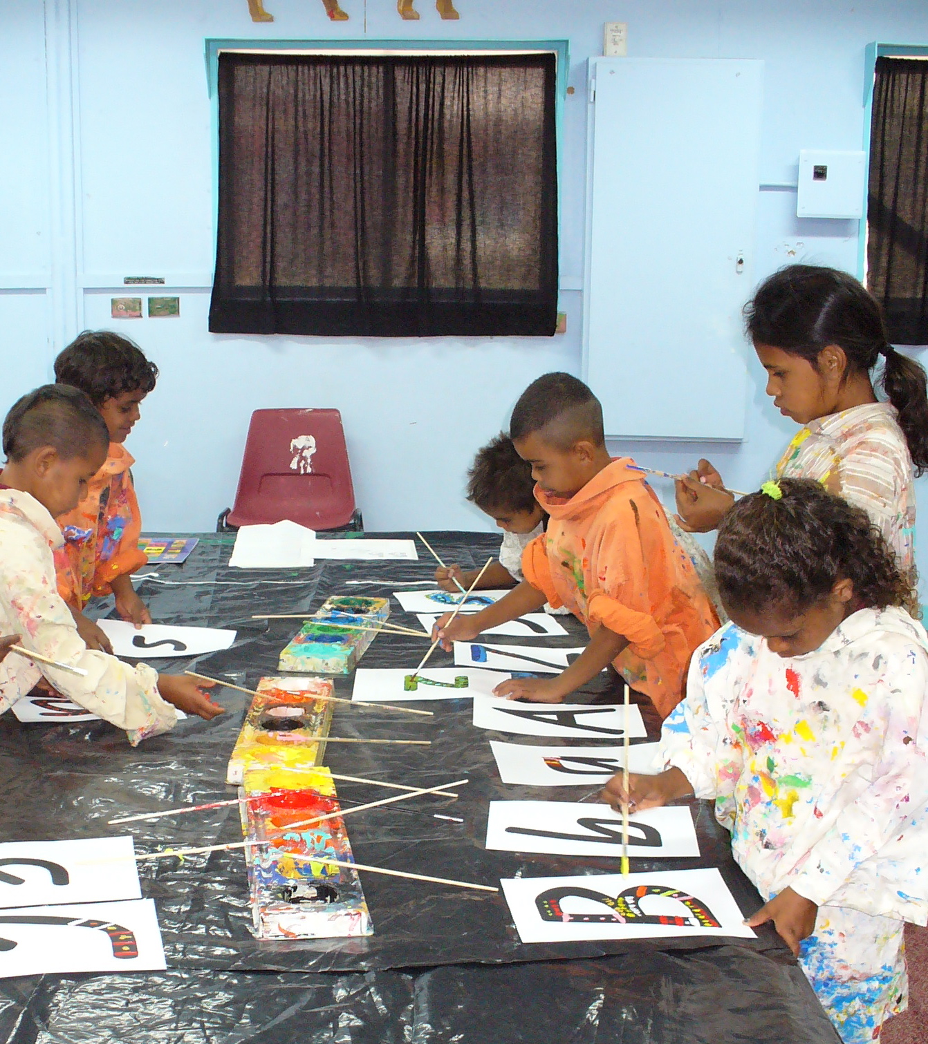 Cherbourg children creating artwork for Budburra's Alphabet