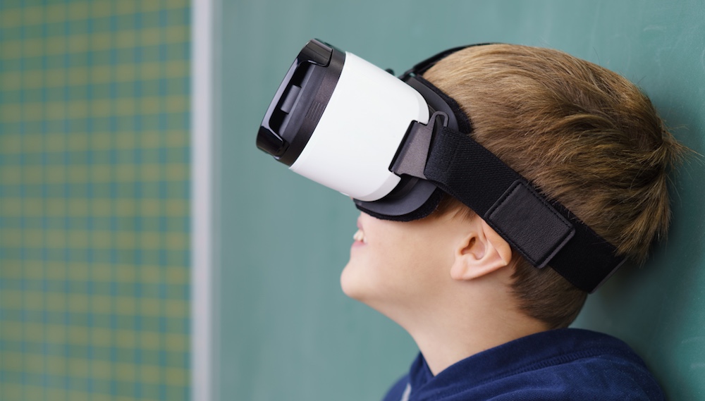 student in classroom with Augmented reality glasses