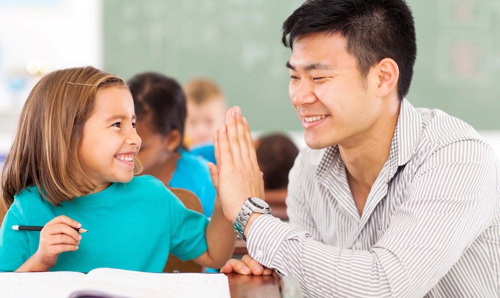 male primary school teacher and student