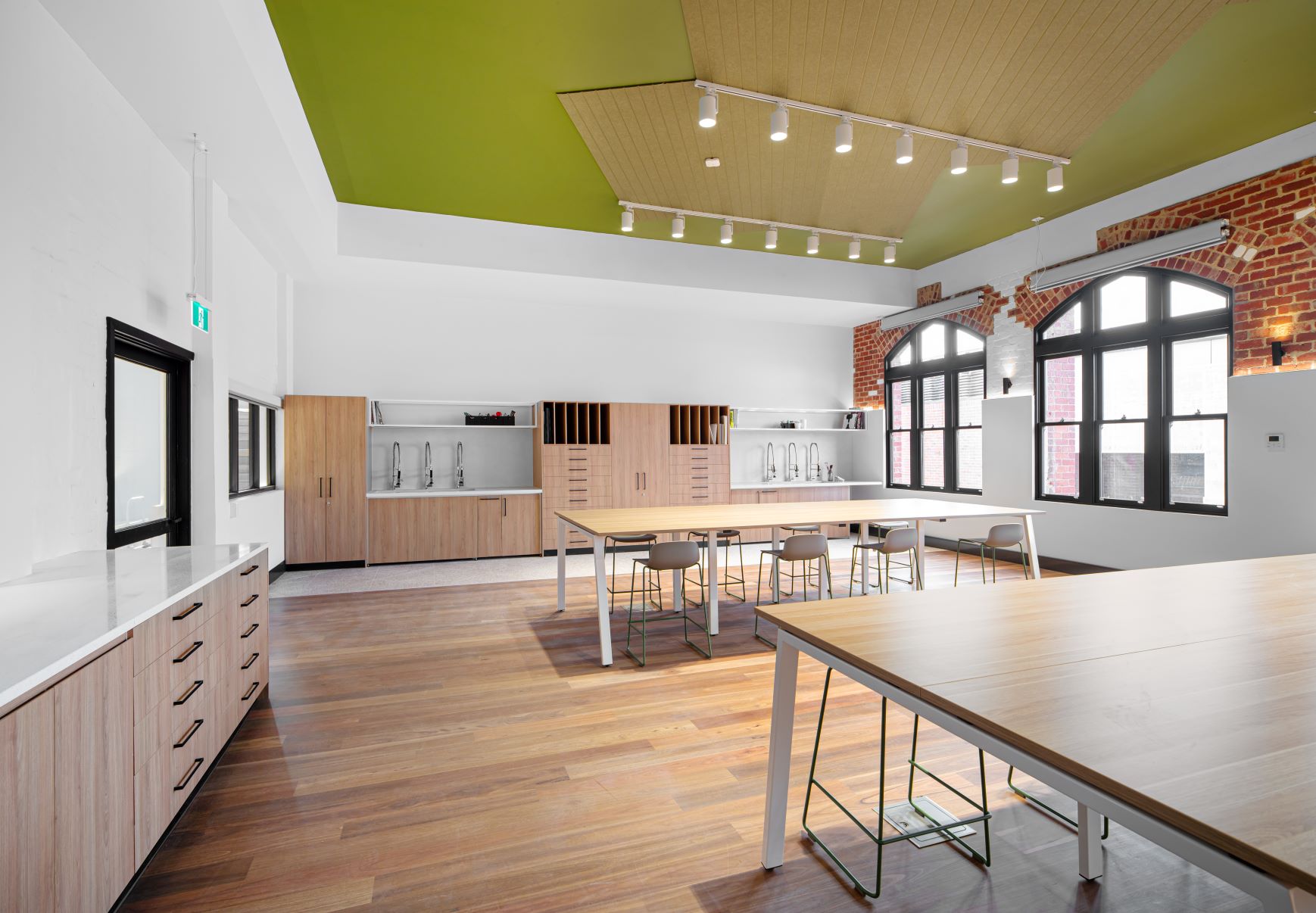 Specialist art learning space at school with wooden floors, high ceilings and large tables