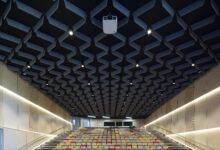 Large empty auditorium with specialised overhead acoustic installation