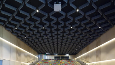 Large empty auditorium with specialised overhead acoustic installation