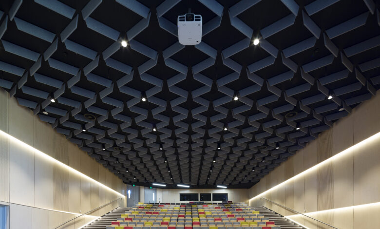 Large empty auditorium with specialised overhead acoustic installation