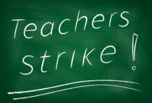 Teachers strike! written on chalkboard