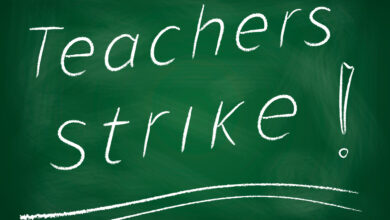 Teachers strike! written on chalkboard
