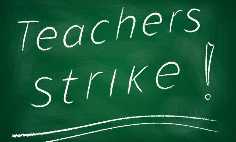 Teachers strike! written on chalkboard