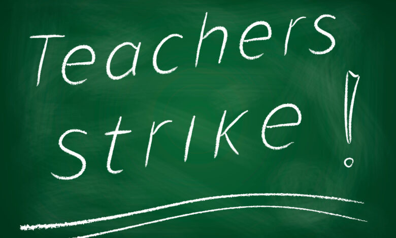 Teachers strike! written on chalkboard