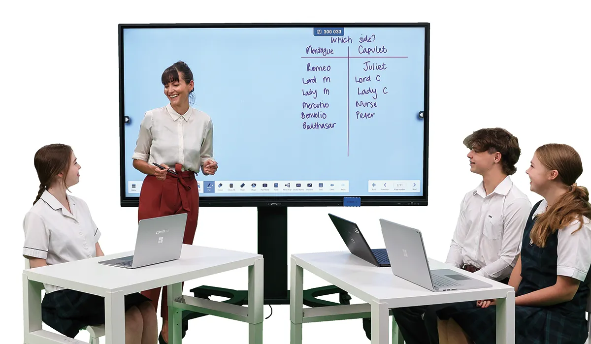 A teacher presenting to students with the help of education technology