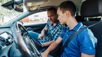 Driving instructor in car with student